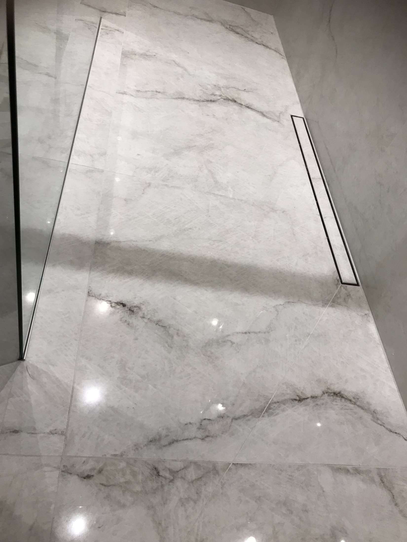 Close-up of glossy white marble tiles